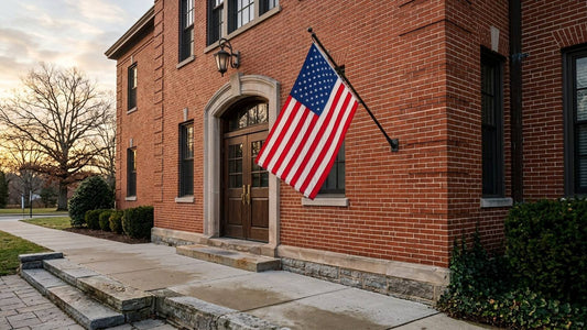 American flag mounted outside an unmarked brick civic building entrance