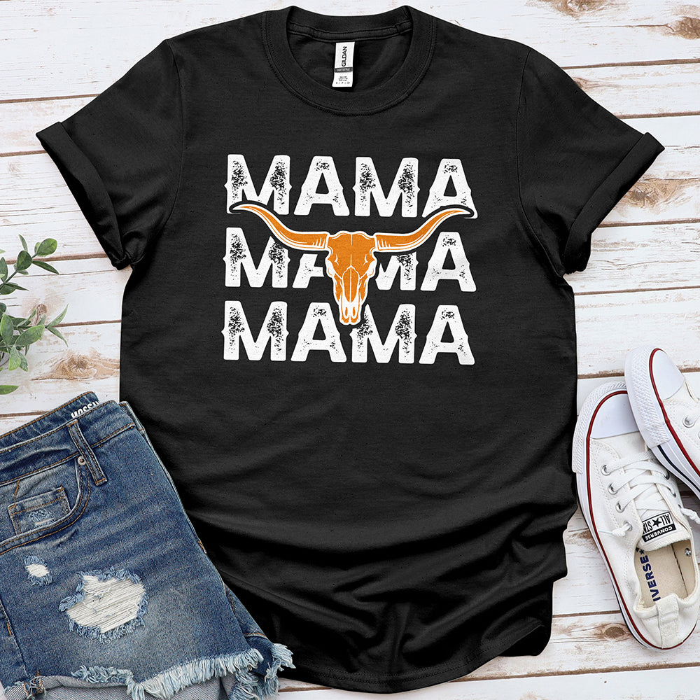 Black graphic tee with 'MAMA' text and longhorn skull, styled with denim shorts and sneakers