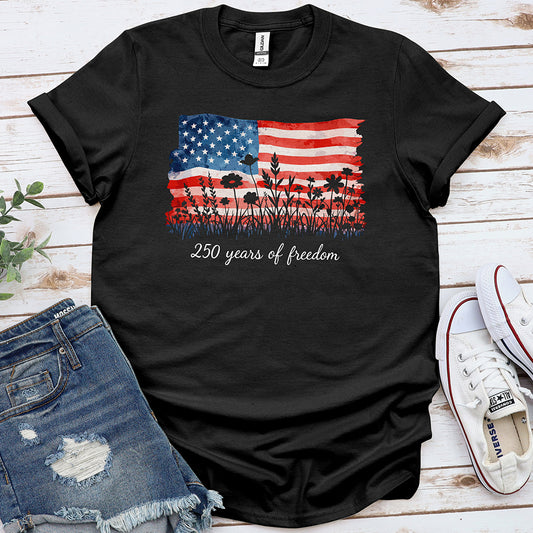 Black t-shirt with distressed American flag, wildflowers, and '250 years of freedom' text