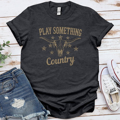Dark heather grey t-shirt with 'Play Something Country' text and longhorn skull graphic.