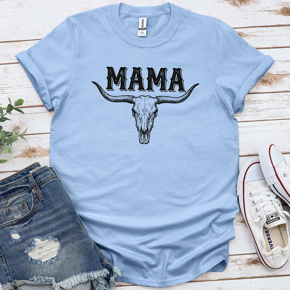 Light blue western graphic tee with 'MAMA' and bull skull, styled with denim shorts