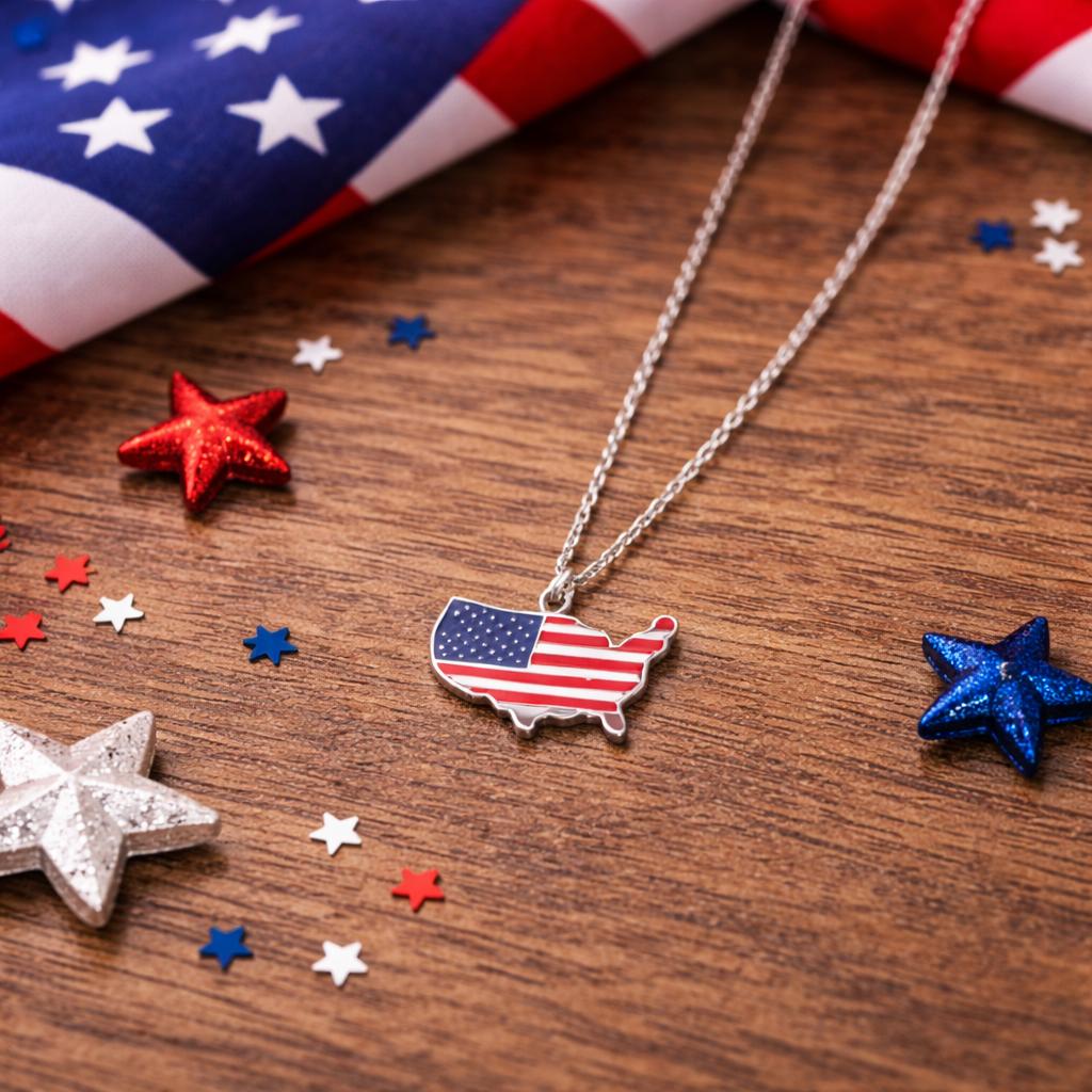 Silver necklace with USA map flag pendant on wood, surrounded by patriotic stars and confetti