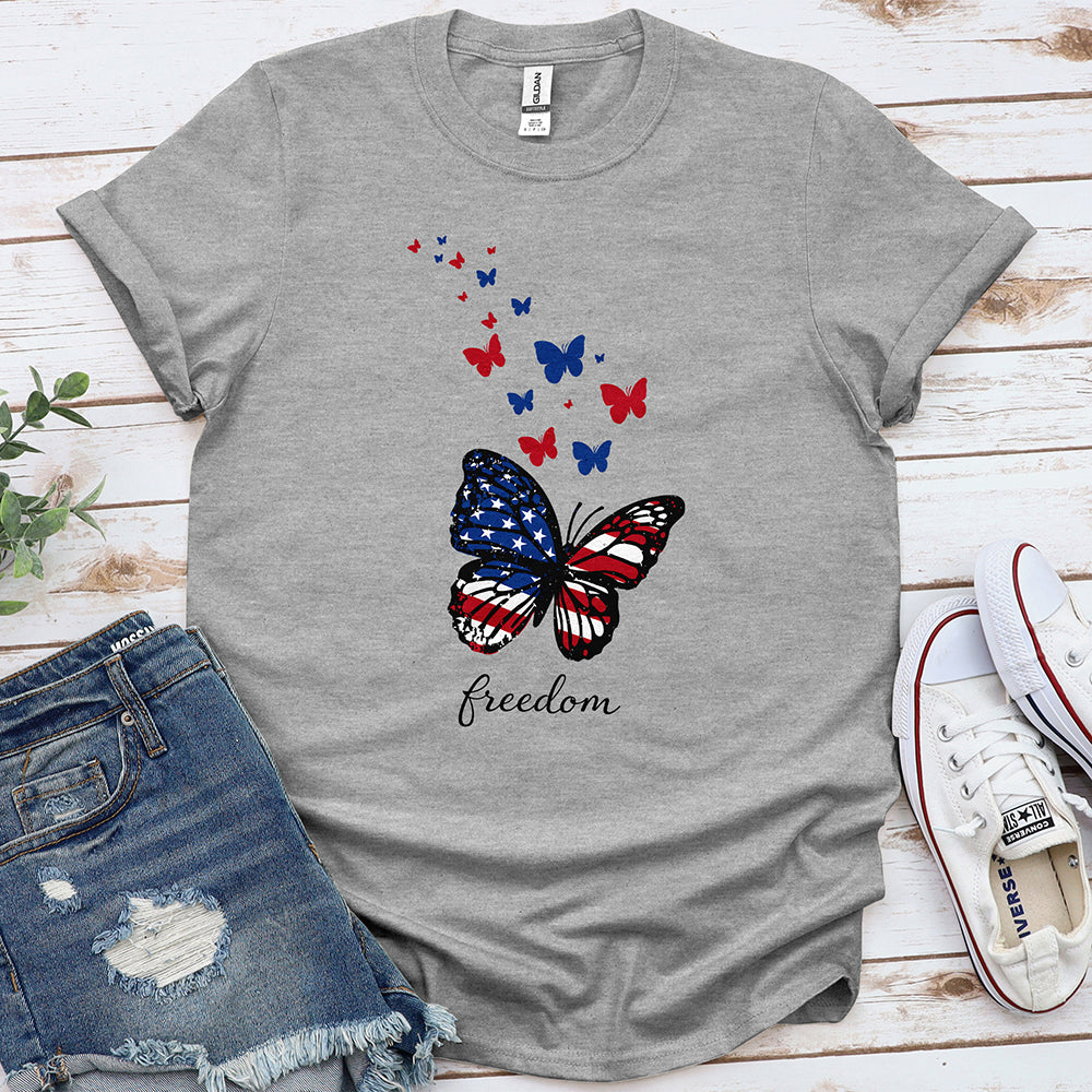 Gray t-shirt with patriotic butterfly and freedom text, styled with denim shorts and sneakers