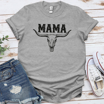 Sport grey graphic t-shirt with 'MAMA' and bull skull design, laid flat with denim shorts and sneakers