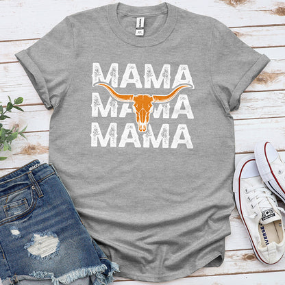 Sport grey graphic tee with 'MAMA' text and orange longhorn skull, laid with denim shorts and sneakers
