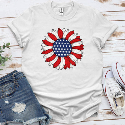 White t-shirt with patriotic sunflower American flag graphic, styled with denim shorts and sneakers