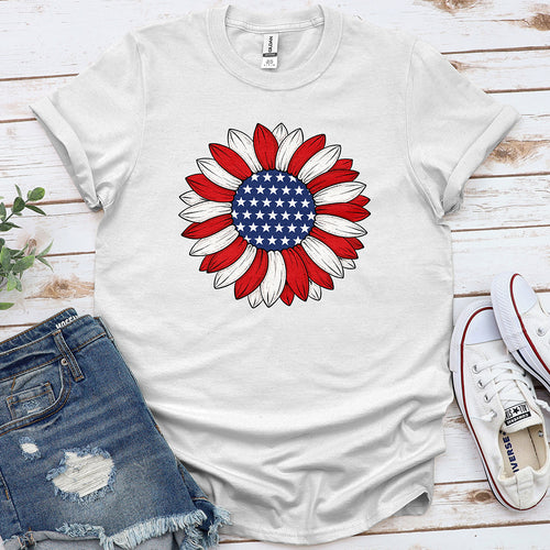 White t-shirt with patriotic sunflower American flag graphic, styled with denim shorts and sneakers