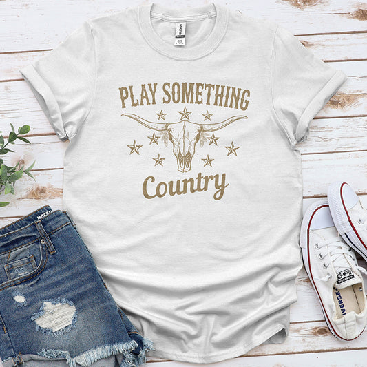White country graphic tee with longhorn skull, stars, and text 'Play Something Country'