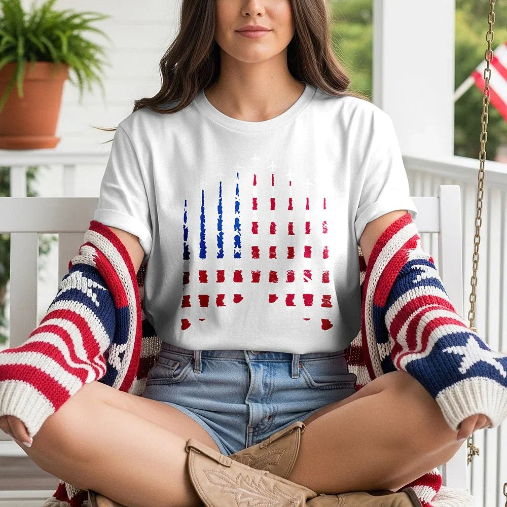 Woman wearing Proud & Free white American flag smoke tee with patriotic cardigan on porch