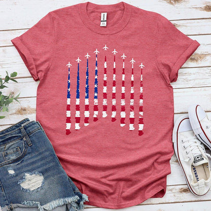 Red Proud & Free t-shirt with distressed American flag and airplane design, styled with shorts and sneakers