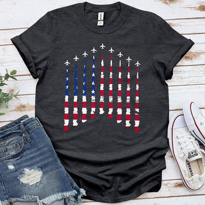 Charcoal tee with American flag airplane smoke graphic, styled with denim shorts and sneakers