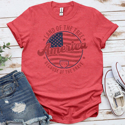 Red America patriotic t-shirt with US flag, 'Land of the Free Because of the Brave', denim shorts, sneakers