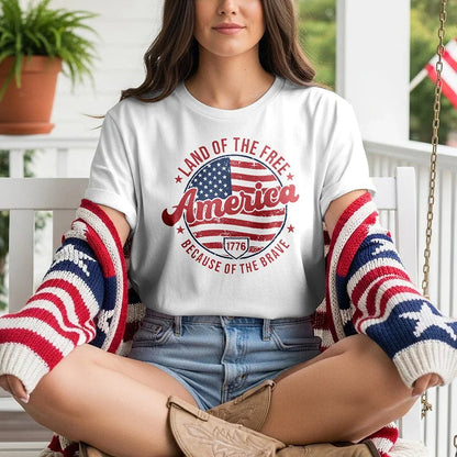 Woman on porch wearing Land of the Free America t-shirt and patriotic flag sweater