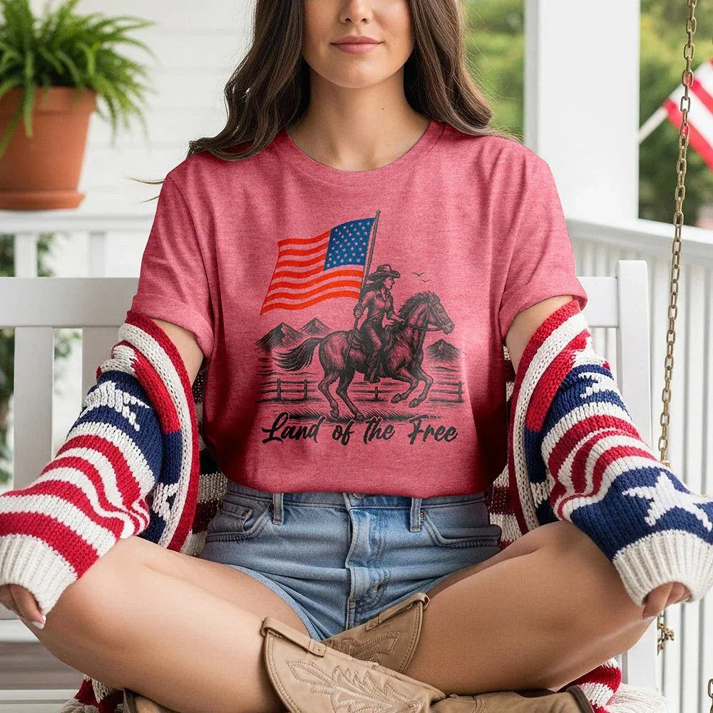 Woman wearing red Land of the Free tee with cowboy and American flag, patriotic cardigan