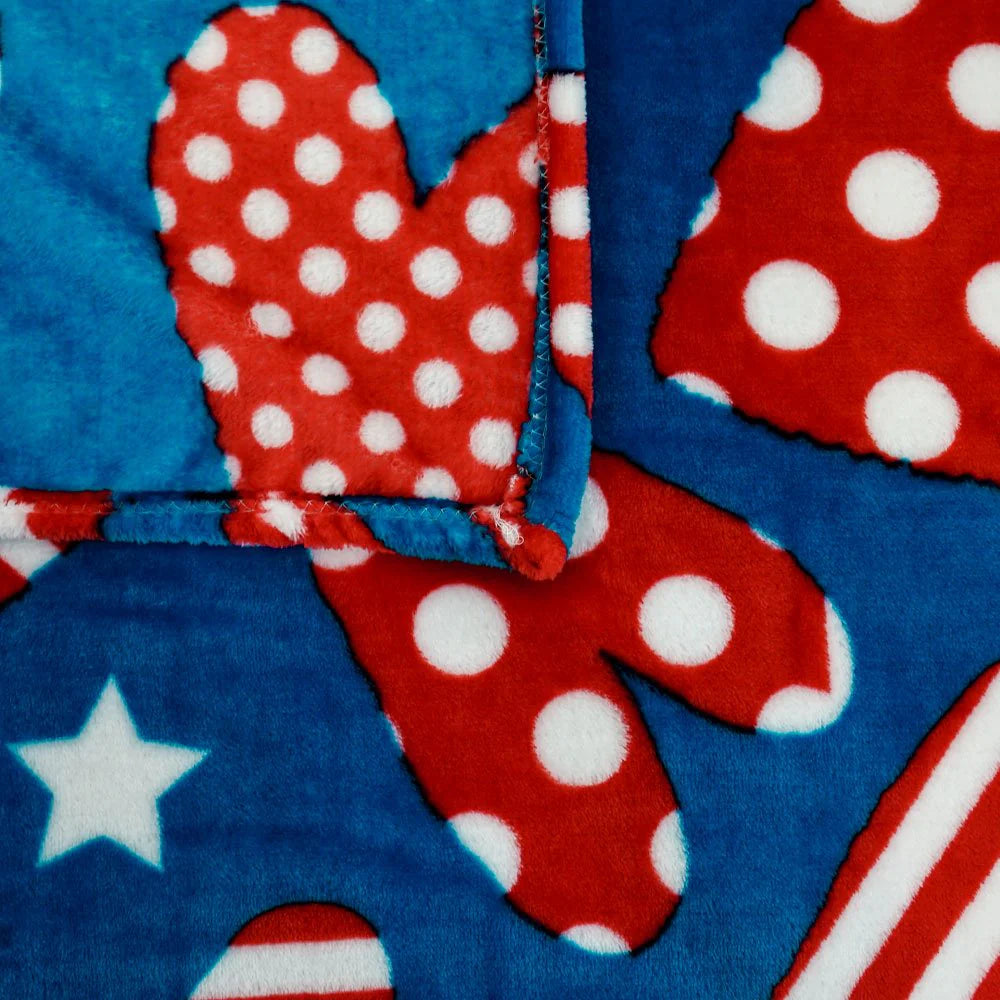 Soft plush blanket with red and white polka dot hearts, blue background, patriotic style