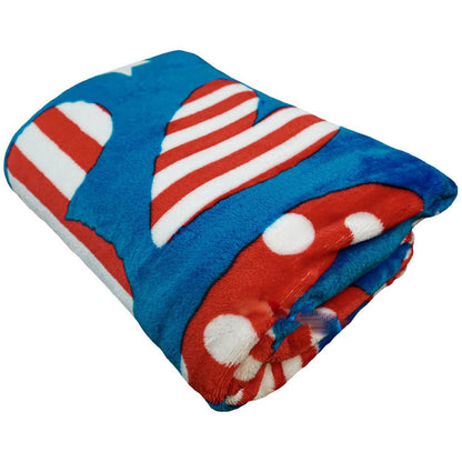 Folded plush blanket with red, white, and blue patriotic heart pattern