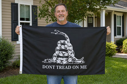 Black Don’t Tread On Me Gadsden Flag held in yard