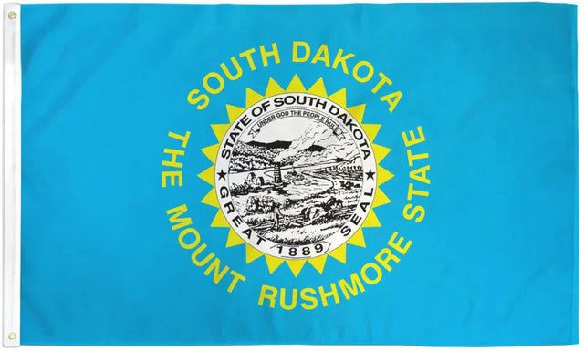 South Dakota state flag with blue background, state seal, and yellow Mount Rushmore State text