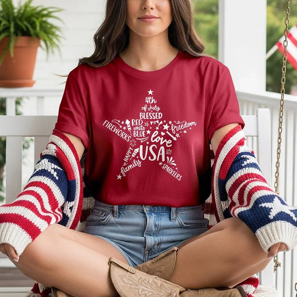 Woman wearing a red Star of Freedom USA t-shirt with patriotic design, porch setting, Proud & Free