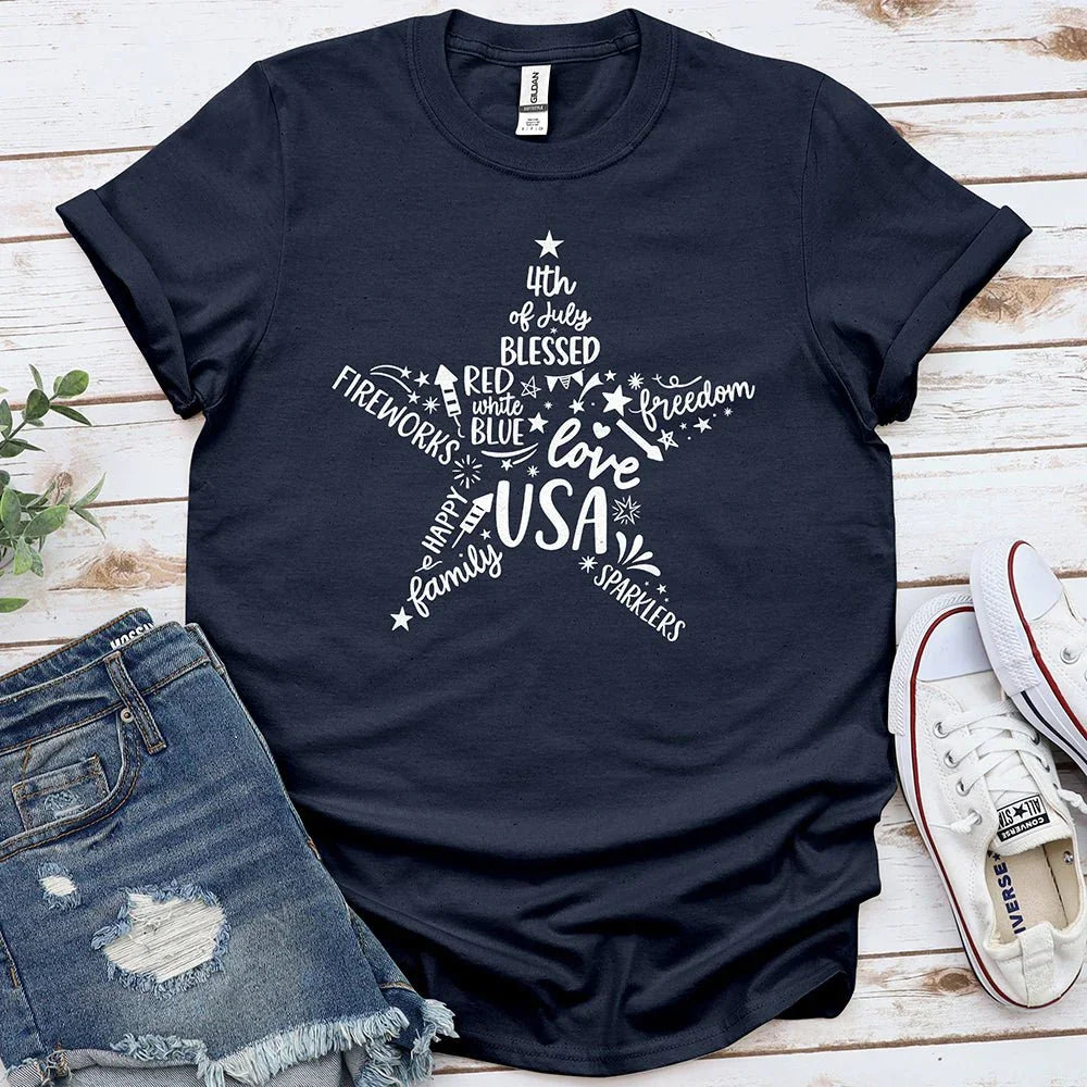 Navy Star of Freedom tee with USA patriotic words, flat lay with denim shorts and sneakers