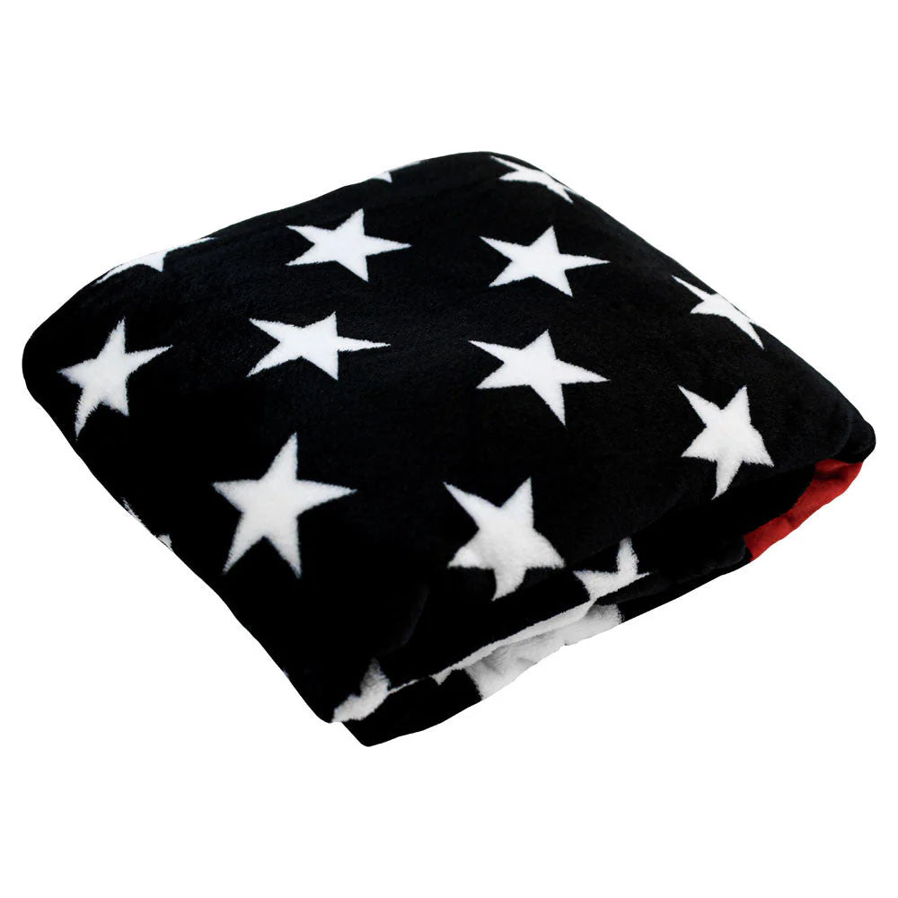 Folded plush blanket with black and white stars, soft fleece, patriotic home decor