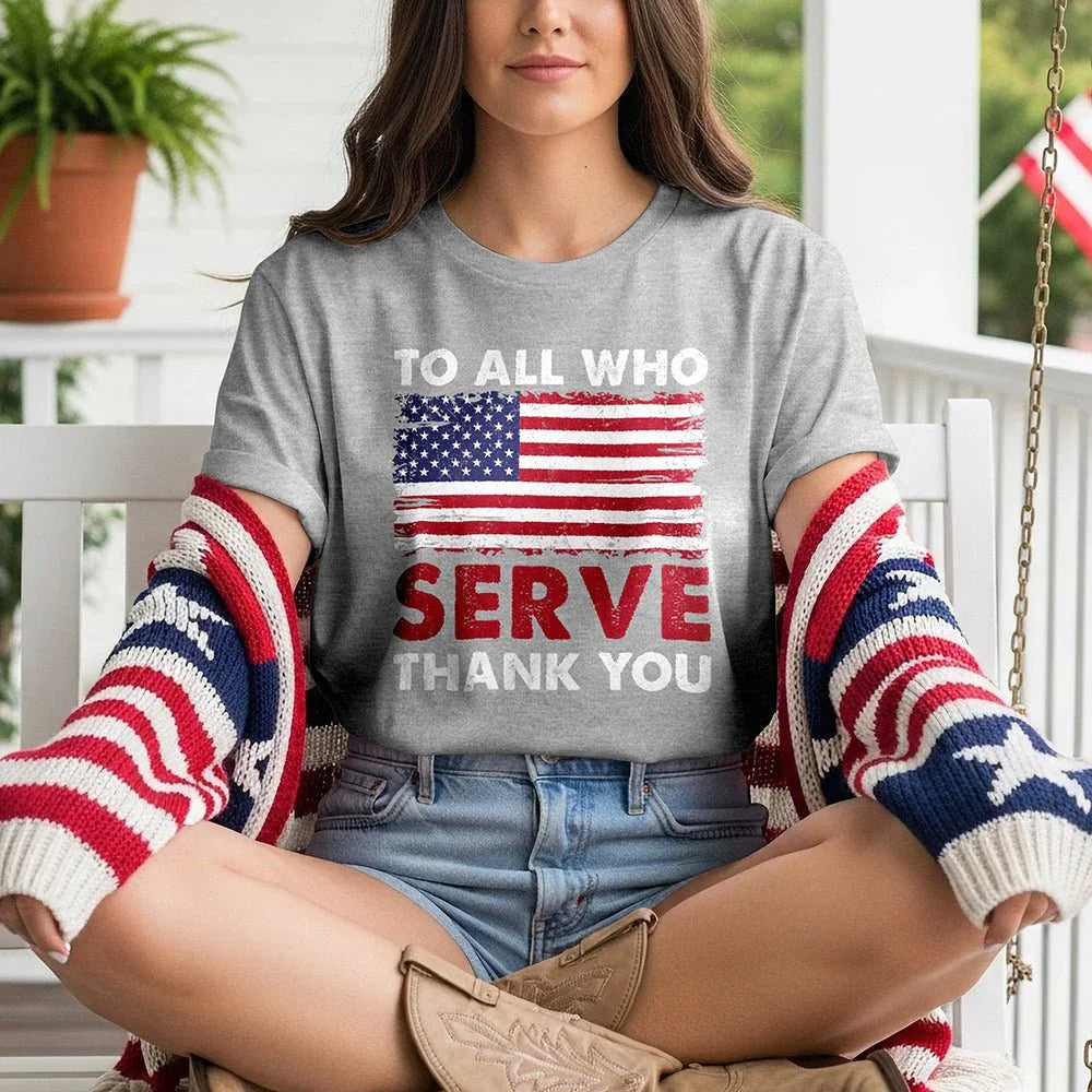 Woman wearing American flag serve thank you tee and patriotic sweater on porch